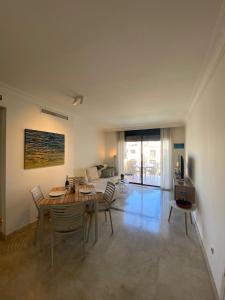 a living room with a wooden table and chairs at Roda Golf Sunparadise in San Javier