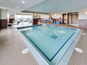 a large swimming pool in a hotel room at DoubleTree by Hilton Edmonton Downtown in Edmonton