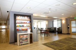 an office with a large refrigerator and a table with chairs at Hampton Inn Ellensburg in Ellensburg