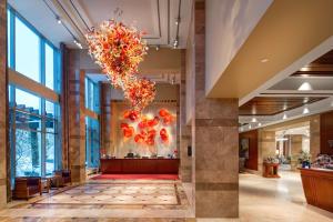 a lobby of a hotel with a chandelier at Hilton Lac-Leamy in Gatineau