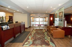 a lobby with a waiting room with a reception desk and a waiting room at Hampton Inn by Hilton Brampton - Toronto in Brampton