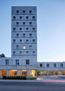 a rendering of a building at night at Das Flint in Dornbirn