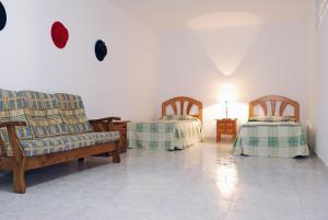 Cama ou camas em um quarto em Apartamentos HC Burriana Playa