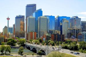 a city with a bridge in front of a city at Hampton Inn & Suites by Hilton Calgary University NW in Calgary