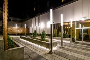 a building with a row of lights in a courtyard at Homewood Suites by Hilton Calgary Downtown in Calgary