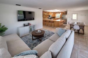 a living room with a couch and a table at Bean Point Residence in Anna Maria