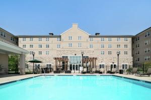 a large swimming pool in front of a building at Homewood Suites by Hilton Philadelphia-Valley Forge in Audubon