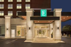 a building with a sign on the front of it at Embassy Suites By Hilton Toronto Airport in Toronto