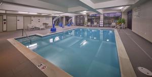 a large swimming pool with blue water in a building at Hampton Inn & Suites Hood River in Hood River