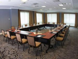 a large conference room with a long table and chairs at Hilton Harrisburg near Hershey Park in Harrisburg +42 photos