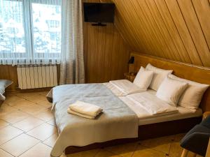 Posteľ alebo postele v izbe v ubytovaní APLIT GUEST HOUSE