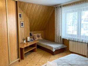 Posteľ alebo postele v izbe v ubytovaní APLIT GUEST HOUSE