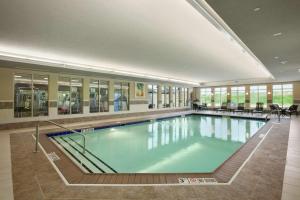 a large swimming pool in a building at Hilton Garden Inn Springfield, MO in Springfield