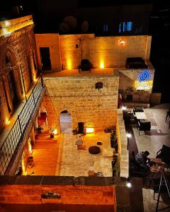 an aerial view of a building at night at Fairouz Konak Otel in Mardin