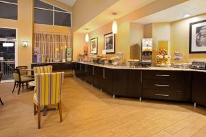 a large room with a counter and some chairs at Hampton Inn & Suites Cleveland-Independence in Independence