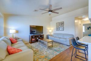 a living room with a couch and a table at Prescott Valley Retreat with Hot Tub and Kayaks in Prescott Valley