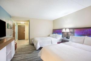 Letto o letti in una camera di Hampton Inn Fishkill