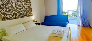 Кровать или кровати в номере Avatonblue Villa Nafplio