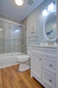 a bathroom with a toilet and a shower and a sink at BEAUTIFUL BEACHFRONT-Oceanfront First Floor 2BR 2BA Condo in Cherry Grove, North Myrtle Beach! RENOVATED with a Fully Equipped Kitchen, 3 Separate Beds, Pool, Private Patio & Steps to the Sand! in Myrtle Beach