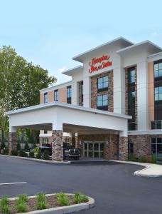 a front view of a hotel with a parking lot at Hampton Inn & Suites Philadelphia/Media in Media