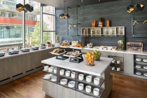 a kitchen with a counter with food on it at Hilton Vancouver Downtown, BC, Canada in Vancouver