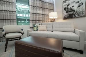 a living room with a couch and a chair at Hilton Austin Airport in Austin