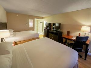 Ένα ή περισσότερα κρεβάτια σε δωμάτιο στο DoubleTree by Hilton Buffalo-Amherst
