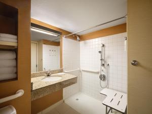 a bathroom with a sink and a shower at Fairfield Inn & Suites Denver Cherry Creek in Denver