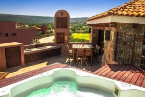 a pool on a patio with a table and a house at Luxury at a great price in San Miguel in San Miguel de Allende