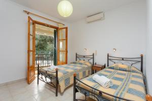 A bed or beds in a room at Villa Sofia