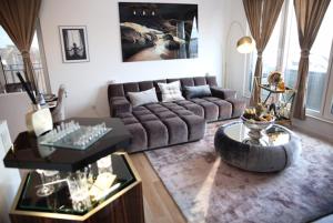 a living room with a couch and a coffee table at RoyalDeluxe Penthouse by Kevany in Cologne