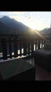 a balcony with a view of the water and mountains at Châlet Champex-lac in Champex