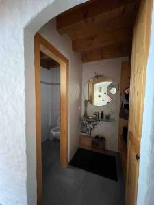 a small bathroom with a sink and a toilet at Châlet Champex-lac in Champex