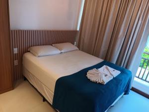 Ένα ή περισσότερα κρεβάτια σε δωμάτιο στο Beach Premium Praia do Forte +24 φωτογραφίες