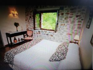 Cama o camas de una habitación en Apartamentos Rurales Larrago