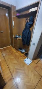a room with a hallway with a door and a backpack at Уютная трехкомнатная квартира с видом на море в Баку in Baku