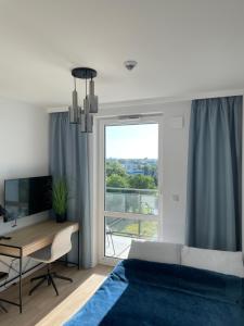 Μια τηλεόραση ή/και κέντρο ψυχαγωγίας στο Cubus Nest Apartment