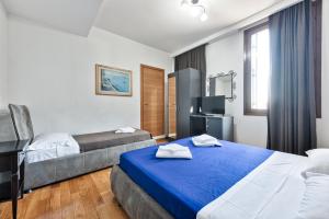 Postel nebo postele na pokoji v ubytování Hotel Trieste