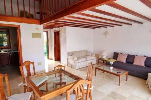 a living room with a couch and a table at FlordeTajinaste in Puerto de la Cruz