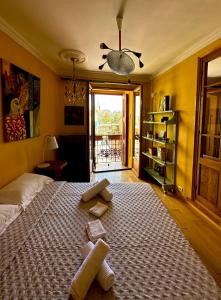 a bedroom with a large bed with towels on it at Lumières à Collioure in Collioure