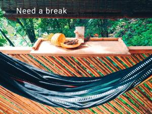a hammock with a banana on top of it at Kakuna Lodge in Minca +16 photos