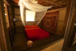 Postel nebo postele na pokoji v ubytování Palawan Ecolodge