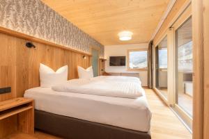 Postel nebo postele na pokoji v ubytování Pension Gulla - Ferienhaus Appartements B&B