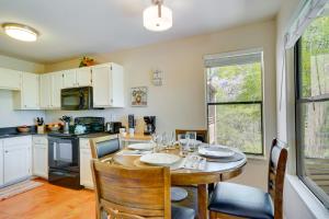 a kitchen and dining room with a table and chairs at Tucson Oasis Heated Pool, Tennis Court, Hiking! in Tucson