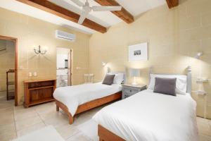 Letto o letti in una camera di Dar ta' Censina Villa with Private Pool