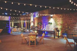 a patio with a bar with lights and chairs at DoubleTree by Hilton Chicago/Alsip in Alsip