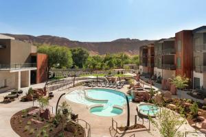 an aerial view of a resort with a swimming pool at Hoodoo Moab, Curio Collection by Hilton in Moab