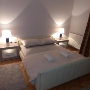 Postel nebo postele na pokoji v ubytování Nova DOM