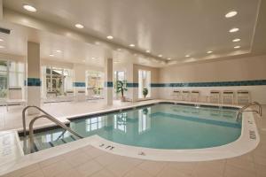 a large swimming pool in a building with a swimming pool at Hilton Garden Inn Bridgewater in Bridgewater