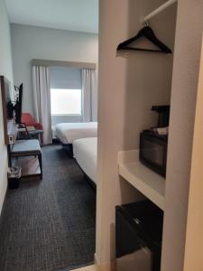 Rúm í herbergi á Comfort Inn Miramar Beach-Destin